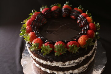 Cake dessert chocolate sweet delicious, cake on a dark brown background.