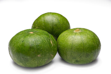 3 small green squash on white background