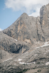 Close up photo of a high rock wall or mountain. Rock walls of limestone in Dolomites, Italy. Marmolada rock walls, Dolomiti, Alto Adige.