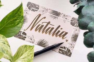 A handwritten greeting card with the name "Natalia" on it.