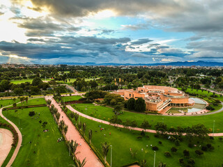 A modern building in the middle of a bogota park