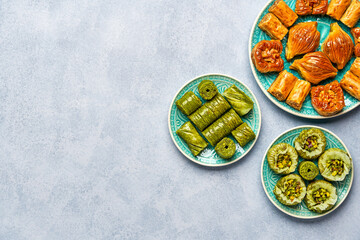 Traditional turkish, arabic sweets baklava assortment with pistachio and walnut. Top view   
