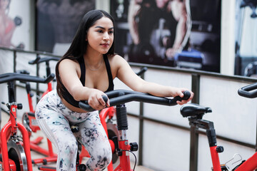 Fototapeta premium young woman training in a gym