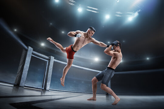 Punch in MMA. Two MMA fighters in the octagon. Hand kick. Sport action concept. 3D