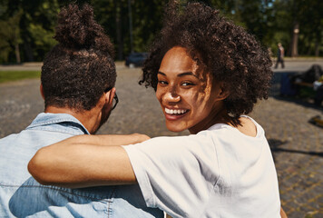 Lovely couple spending free time outdoors on sunny day