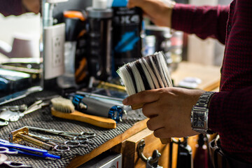 Unrecognizable barber using barber tools