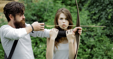 Attractive couple shoots out of the bow