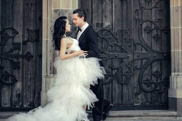 wedding sexy couple near wooden iron door