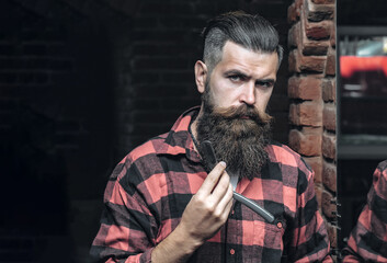 man with razor near mirror