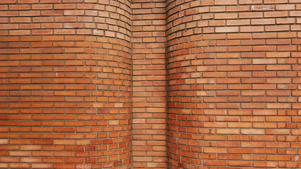 Red color brick wall for brickwork background design . Panorama format 