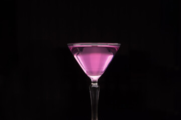 Pink drink in a martini glass.
