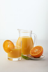 Naklejka na ściany i meble Orange juice with pulp on a white background