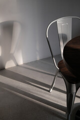 Modern loft grey color metal chair at coffee shop. Creative interior detail photo in lights and...