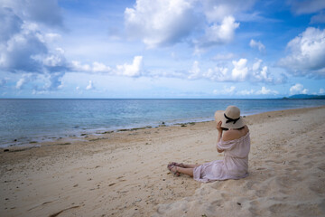 石垣島の海の女性がいる風景 沖縄 Landscape with a woman in the sea in Ishigaki...