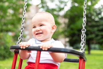 Baby Boy Having Fun on a Swing