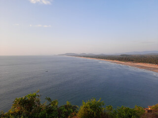Gokarna beach in karnataka, sunset over the ocean, top view of Gokarna beach. tropical sea beach over view. areal view of gokarna beach. 