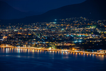 Fototapeta premium Aerial night view of Kalamata city, Greece. Kalamata is one of the most beautiful cities in Greece and a popular tourist destination