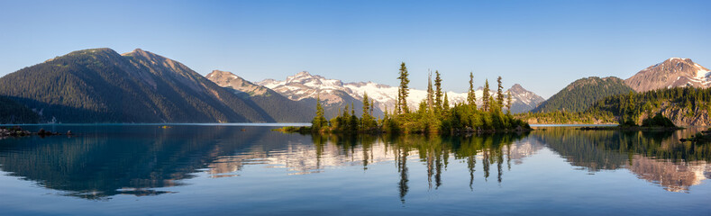 Panoramic View of Canadian Nature Landscape with rocky islands and mountains in the background....