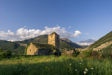 Fototapeta na wymiar Abandoned church in ghost village janovas in pyrenees landscape at golden hour, Spain