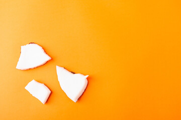 Happy coconuts day concept, fresh coconut group pieces slices, studio shot isolated on orange background