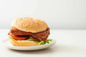 grilled chicken burger with sauce on plate