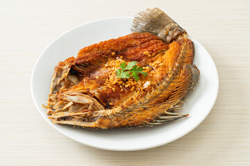 Fried Sea Bass Fish with Garlic