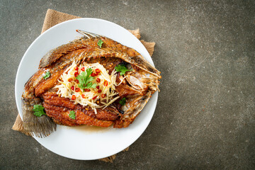 Fried Sea Bass Fish with Fish Sauce and Spicy Salad