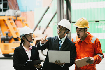 Group of Young executive visits the container storage yard to inspect the work . Transportation and Logistics concepts.