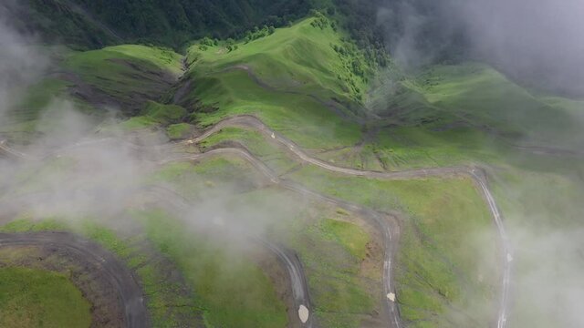 Downward angle cinematic drone shot of one of the world's most dangerous roads, the Abano Pass in Tusheti Georgia