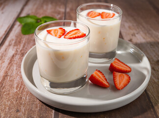 yogurt with strawberries on plate