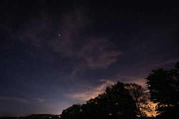 Naklejka premium clouds over the city lights
