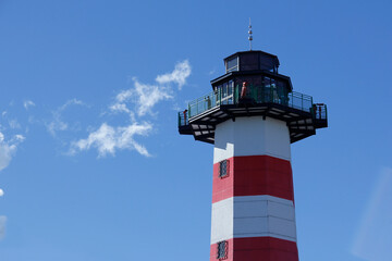 Image of red lighthouse crest with white and space for text. Boquete Tourist Viewpoint - Panama