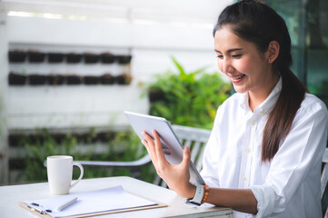 Obraz premium business working on tablet or laptop at home, communication internet cyberspace technology, online job lifestyle on computer network work, young person at home office