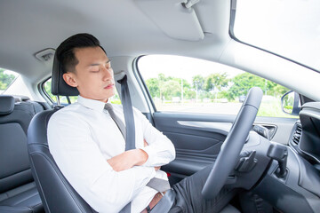 asian businessman sleep in car