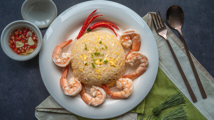 Shrimp fried rice with egg, garnished with spring onions, Asian style
