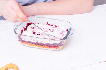 Step by step preparation of russian traditional appetizer  - herring under layers of boiled vegetables and mayonnaise (shuba). step 8  of 11  - spread mayonnaise on layers of grated vegetables