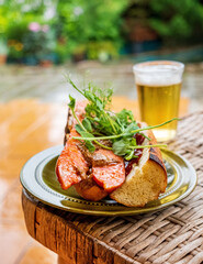 Grilled hot dogs with beer