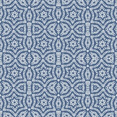 abstract seamless tiled pattern with stars on blue background 