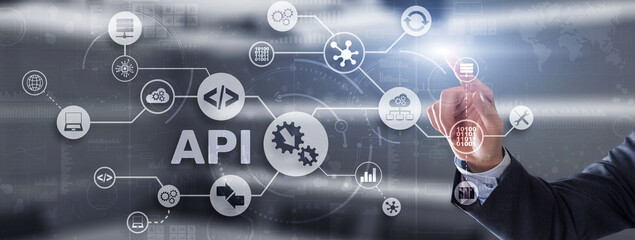 Application Programming Interface. API software development tool. Information technology concept. Businessman presses API text icon on a virtual interface