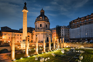 Trojan column and churches of Santa Maria di Loreto. Ruins of a forum of Trajan in the night....
