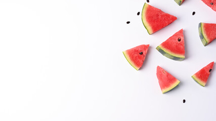 Slices of fresh watermelon on white background with copy space.