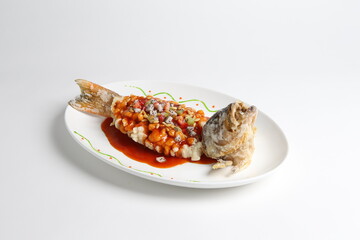 braised cook fresh grouper fish in chef special sweet and sour sauce in white background asian halal seafood menu