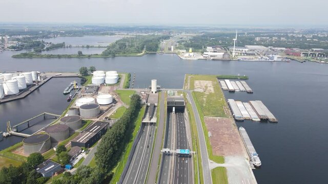 Coentunnel Amsterdam West, A10 highway going under the river Ij. Aerial drone view.