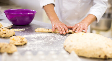 Obraz na płótnie Canvas Closeup shot of making sweet buns with dough and eggs