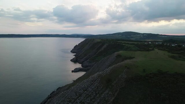 Three Cliffs Bay Beach During Sunset In Gower Peninsula, Swansea, Wales. - aerial