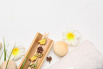 Beautiful spa composition with flowers on light background