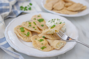 Pierogi ruskie, Baked dumplings stuffed with curd cheese and potatoes