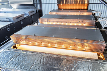 Machine drying wheat grains on conveyor