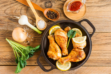 Grilled chicken legs with spices and garlic. Top view