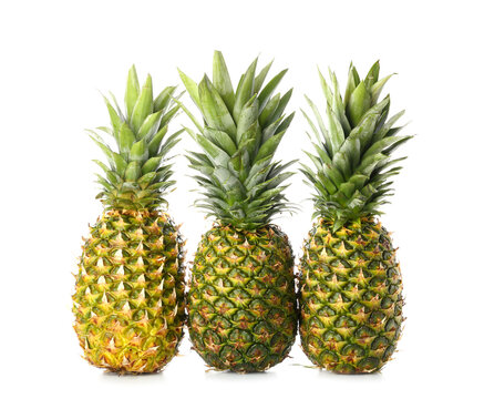 Fresh pineapples on white background © Pixel-Shot